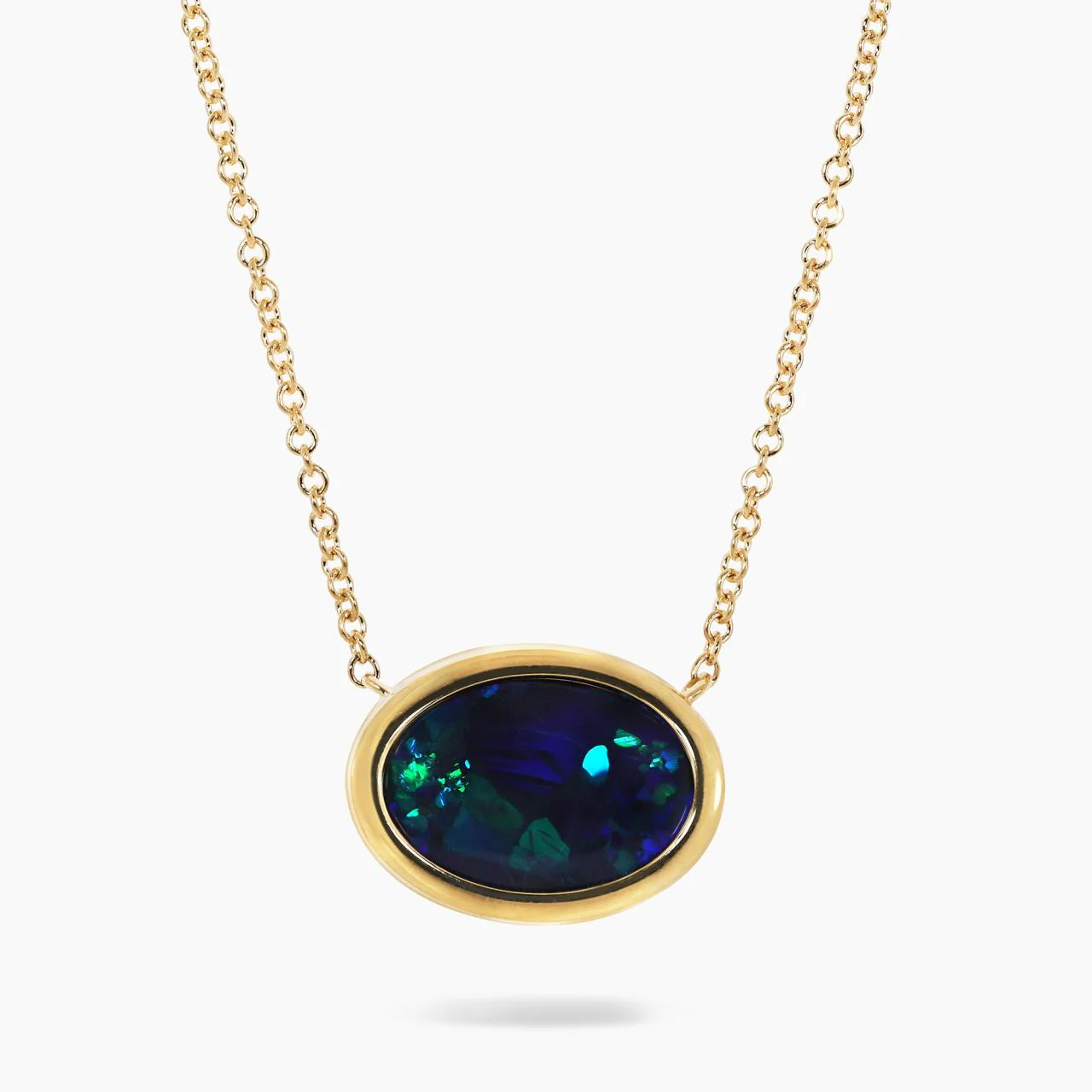 18ct yellow gold 2.60ct oval cut solid black Lightning Ridge Opal bezel set on an 18ct yellow gold 45cm chain