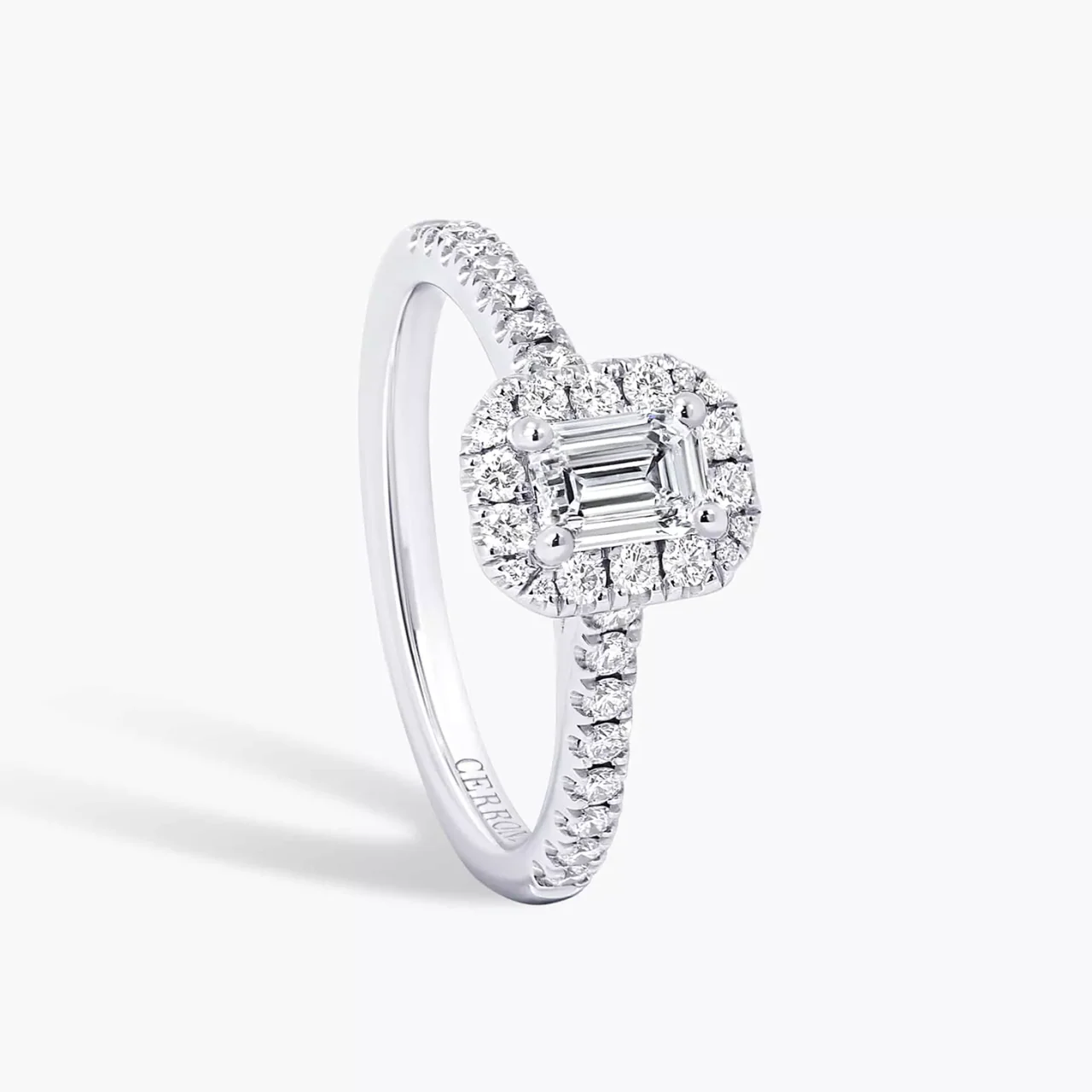 18ct white gold 0.50ct E VS1 emerald and round brilliant cut diamond halo engagement ring