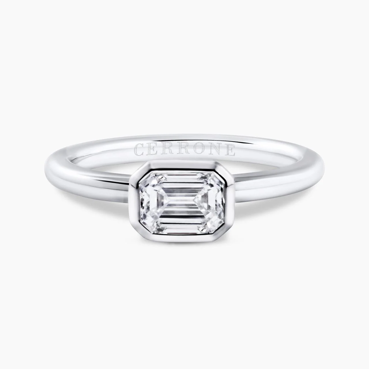 18ct white gold emerald cut bezel set diamond solitaire engagement ring