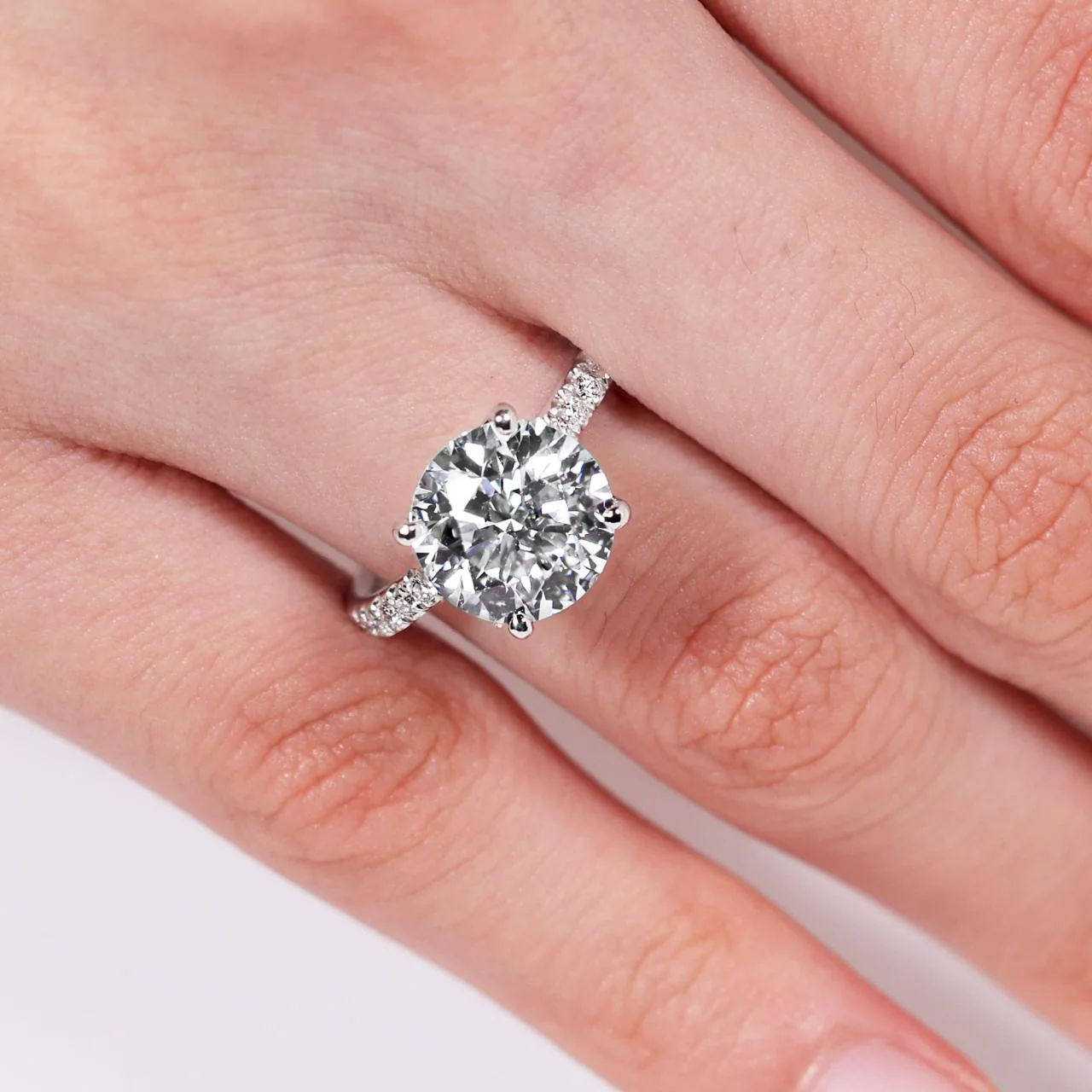 18ct white gold round briliant cut diamond engagement ring in a four claw setting with a hidden halo and diamond band. GIA cert - Image 2