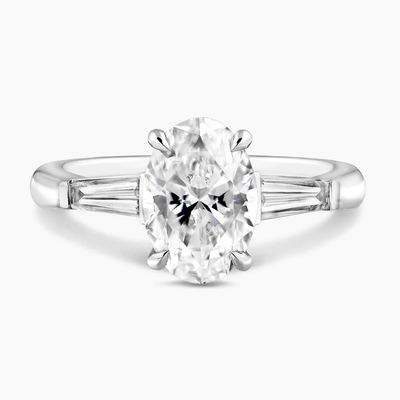 18ct white gold 1.80ct oval brilliant cut diamond engagement ring features 2=0.46ct tapered baguette diamonds GIA Cert