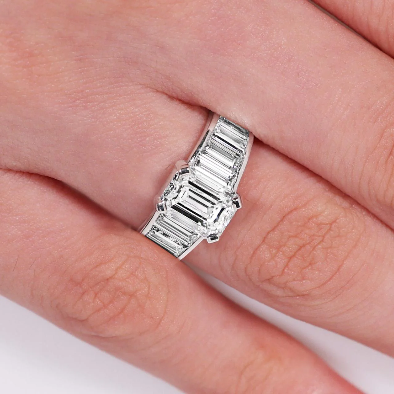 18ct White gold emerald cut diamond engagement ring with baguette cut diamonds on the band - Image 2