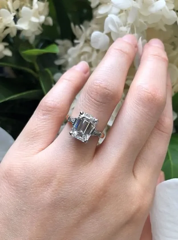 Platinum and rose gold emerald and tapered baguette trilogy engagement ring - Image 3